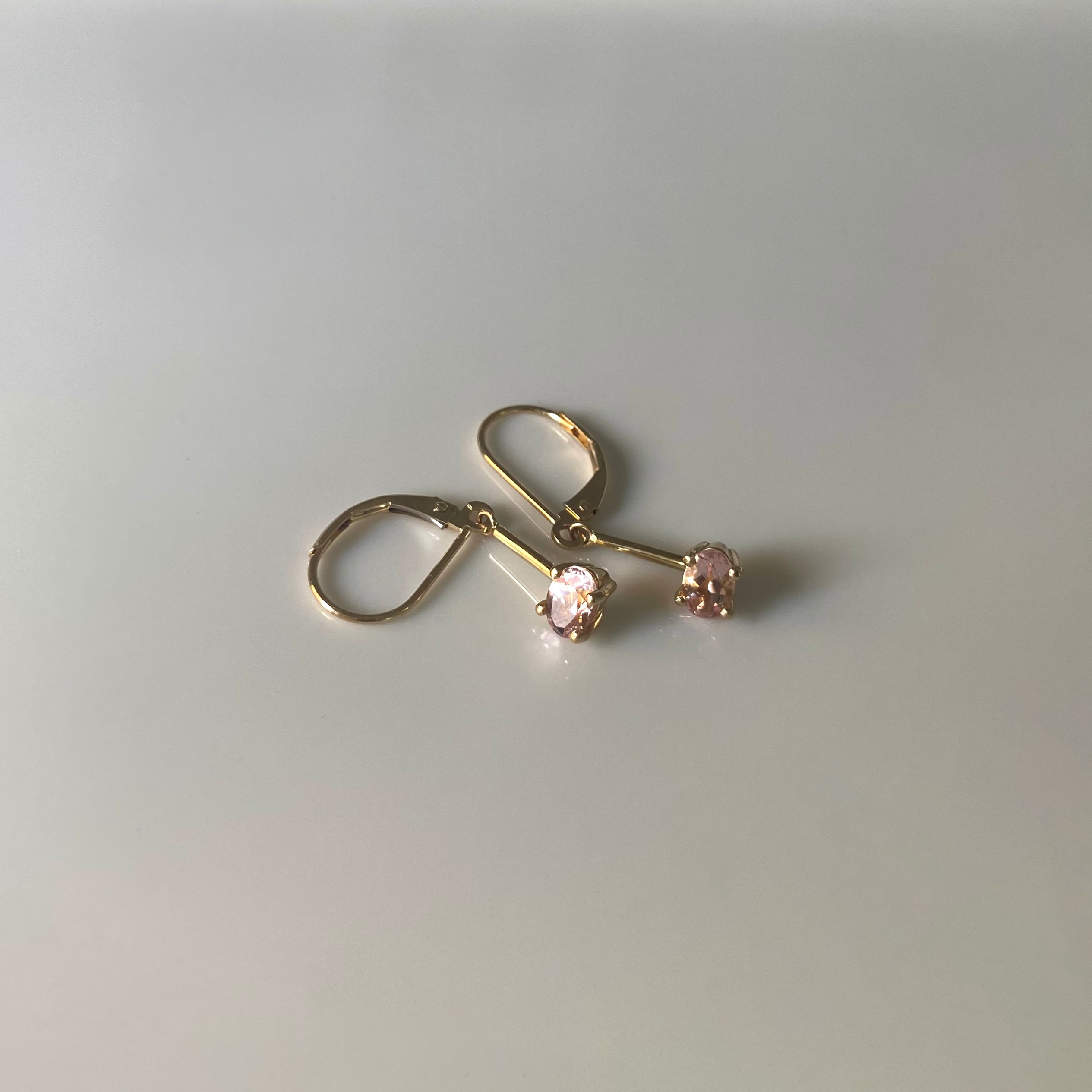 14 karat gold morganite earrings on white background
