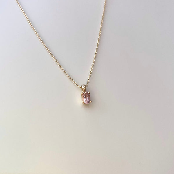 a 14 karat gold morganite and diamond set necklace